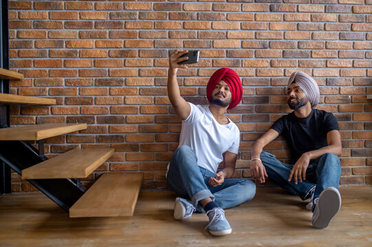 Two indian men in turbans making selfie
