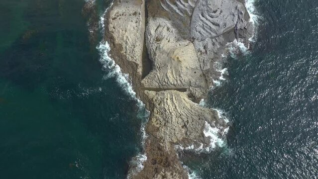 Aerial View of Cape Stolbchaty and Mendeleev Volcano on Background, Kunashir island, Russia.