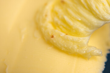 Naklejka na ściany i meble macro texture of butter. close up.