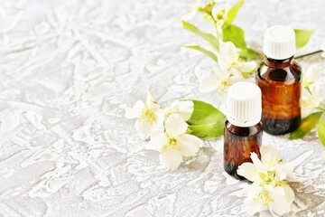 Oil of jasmine. Aromatherapy with jasmine oil. Jasmine flowers