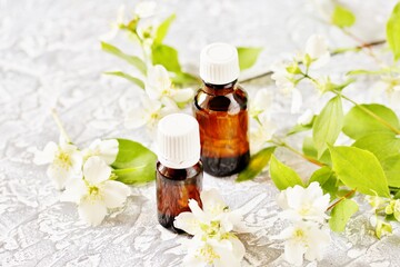 Obraz na płótnie Canvas Oil of jasmine. Aromatherapy with jasmine oil. Jasmine flowers