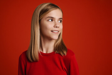 Fototapeta premium Blonde white girl wearing sweater smiling and looking aside