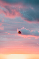 paragliding sunset tropical