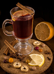 Hot delicious drink mulled wine with cardamom orange in cold winter