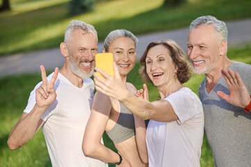 Group of mid aged people making selfie