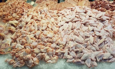 Pieces of chicken on a market stall