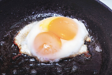 Cooking eggs in a pan, the process of frying eggs in a pan