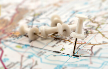 Naklejka premium A paper clip on the map shows the end point of the route. Travel guide. Map of the city, area