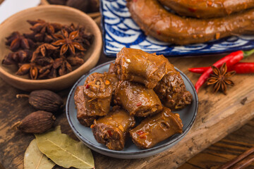 Delicious spiced duck neck on a plate
