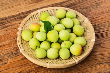 Fresh green plum and preserved green plum