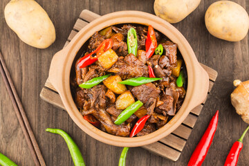 Stewed duck with potatoes in casserole