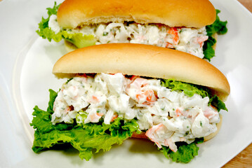 Two Seafood Salad Sandwiches Served on a White Plate