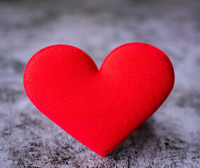 valentine's day concept Red hearts placed on gray background. Center focus.