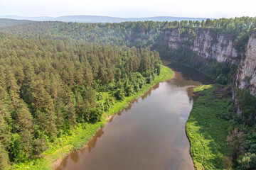 Fototapeta na wymiar Big cliffs (rocks) on the Ay river. Chelyabinsk region, South Ural, Russia