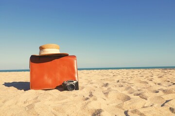 Vintage luggage on  the beach.