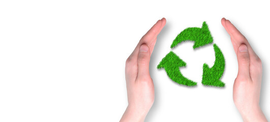 Recycle symbol made of grass with hand protective on white background. Ecology, sustainability and environmental concept