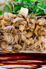 Rice noodles with mushrooms, sesame oil and Kabayaki sauce