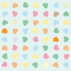 Pastel colored hearts pattern on blue background
