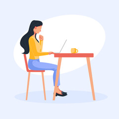 woman with notebook sitting at a table working on a project