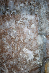 abstract texture of snow and snowflakes on the frozen asphalt with ice for a natural background and for wallpaper