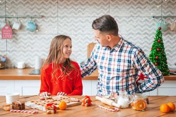 Family baking gingerbread cookies on XmasChristmas vacation