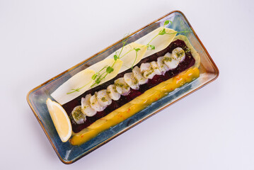 Carpaccio with pumpkin and scallops on a white background