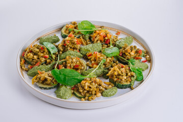 Dish of zucchini, beans and vegetables with spinach sauce