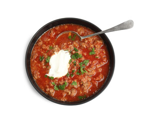Bowl of delicious stuffed pepper soup on white background, top view