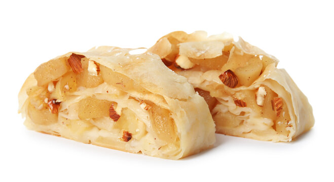 Pieces of delicious apple strudel with almonds on white background