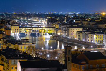 Ponte Vecchio bridge, river Arno promenade and other florentians bridges. Night shot. Medieval...