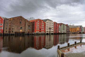 Old warehouses line the Nidelva riverbank, Trondheim, Trøndelag, Norway
