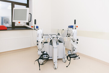 Patient on Continuous Passive Range of Motion machines. Device to provide anatomically correct motion to both the ankle and joints. Foot rehabilitation simulator after injured. Ligament treatment