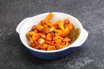 Marinated pickled honey mushrooms in the bowl