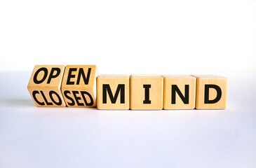 Open or closed mind symbol. Turned wooden cubes and changed concept words closrd mind to open mind. Beautiful white table, white background, copy space. Business open or closed mind concept.