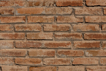Old and weathered wall texture, background with bricks.