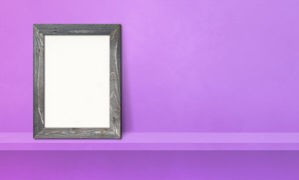Wooden picture frame leaning on a purple shelf. 3d illustration. Horizontal banner