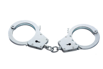 Metal handcuffs on a white isolated background