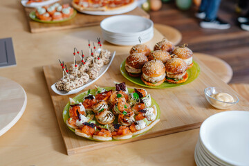 Canapes with cheese balls topped with sesame seeds. Cheese appetizer for the festive table. Food at a youth party.