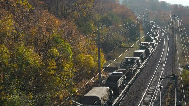 transportation of military equipment by rail.Vehicles and weapons. railway along the forest and mountains