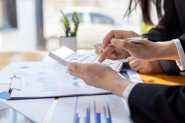Executives and managers are meeting in a conference room, on the table there are some documents about the company's finances, managers are discussing financial information with the management.