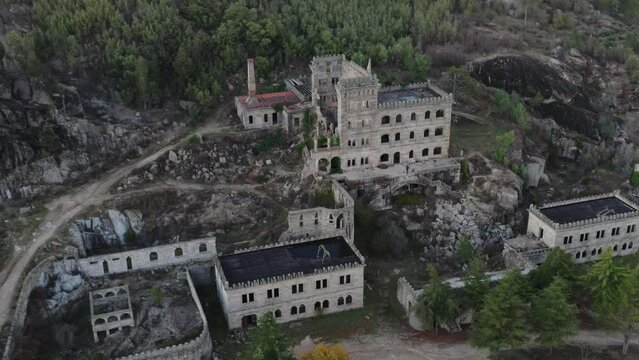 Drone aerial panorama of Termas Radium Hotel Serra da Pena at sunset in Sortelha, Portugal