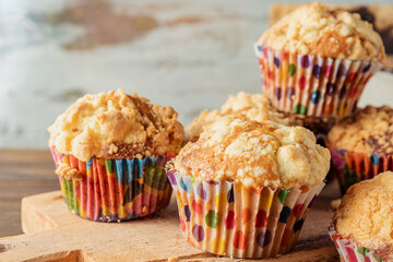Freshly baked homemade blueberry vanilla muffins on a wooden board. high view, close up. Concept natural food, homemade food.