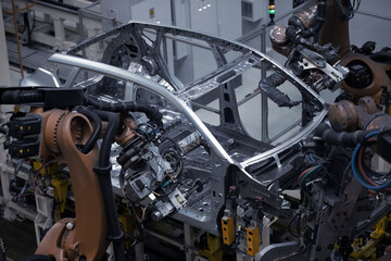Obraz premium Factory, car manufacturing, innovative robotic welding line