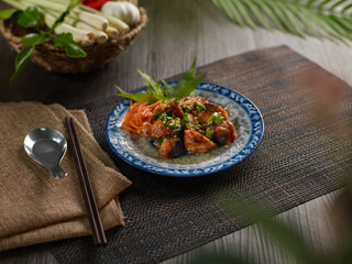 Grilled Lucky Meat Balls in colorful dish on wooden table