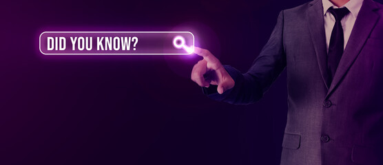 Young Man Touching Did you know question mark Text with Glowing Search Bar. Abstract Futuristic Touch and search concept background