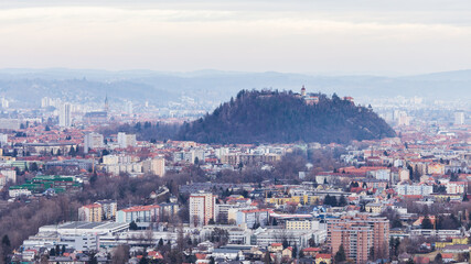 Aerial view of Graz in Austria on a depressive and foggy winter day with lots of fine dust and smog in the air
