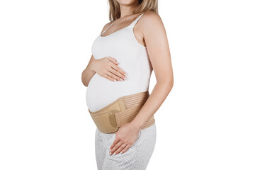 Pregnant woman belly in prenatal pregnancy maternity belt isolated on white background. Support waist, back, abdomen band. Belly Brace. Belly band for pregnancy. Orthopedic abdominal support belt - obrazy, fototapety, plakaty
