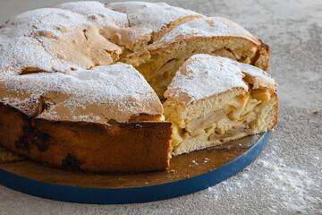 Tasty sweet homemade apple pie, cut into pieces.