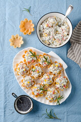 Tartlets with crab sticks, eggs, corn, poppy seeds and caviar.