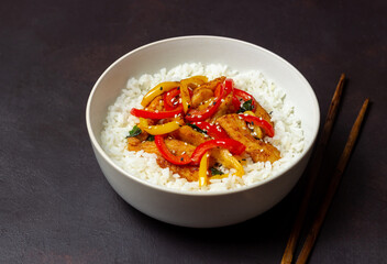 Rice with fried chicken, pepper and sesame. Asian food.